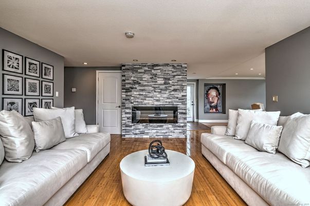 Fireplace, Interior, Living room, Recessed Lighting, Stone Walls, Wood Texture Flooring