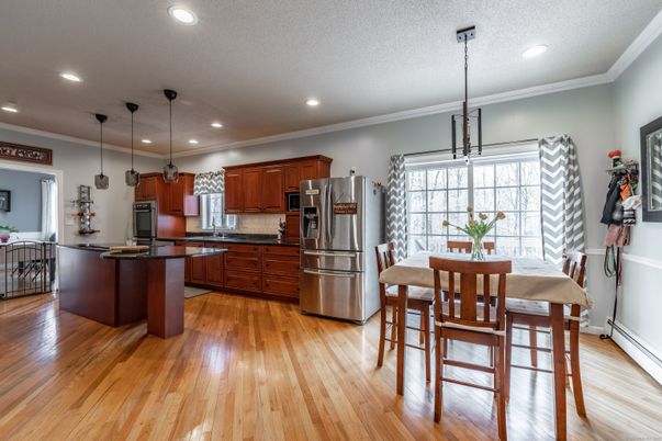 Dining room, Interior, Kitchen, Pendant Lights, Recessed Lighting, Stainless Steel Appliances, Wood Texture Flooring
