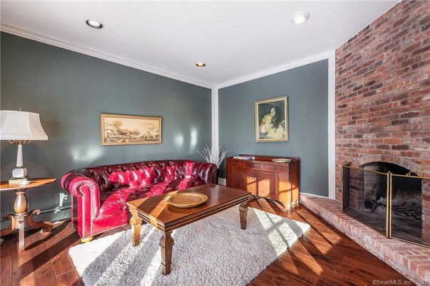 Fireplace, Interior, Living room, Recessed Lighting, Stone Walls, Wood Texture Flooring