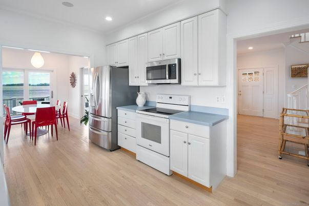 Dining room, Interior, Kitchen, Pendant Lights, Recessed Lighting, Stainless Steel Appliances, Wood Texture Flooring