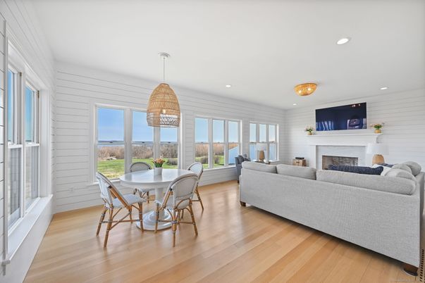 Dining room, Fireplace, Interior, Living room, Pendant Lights, Recessed Lighting, Wood Texture Flooring