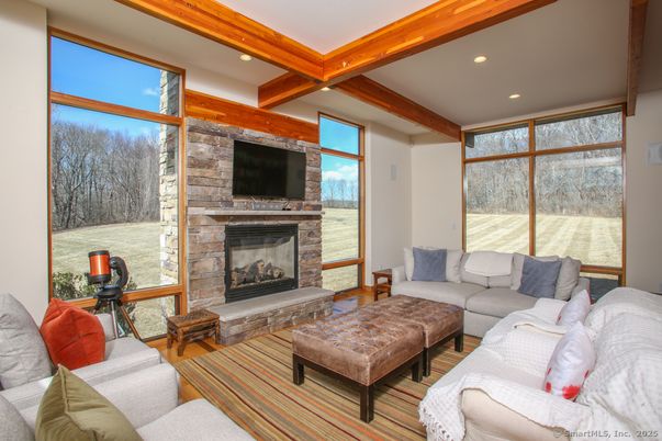 Fireplace, Interior, Living room, Recessed Lighting, Stone Walls, Wooden Beams, Wood Texture Flooring