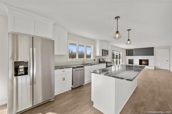 Fireplace, Interior, Kitchen, Pendant Lights, Stainless Steel Appliances, Wood Texture Flooring