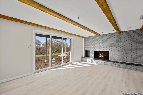Empty room, Fireplace, Interior, Stone Walls, Wooden Beams, Wood Texture Flooring