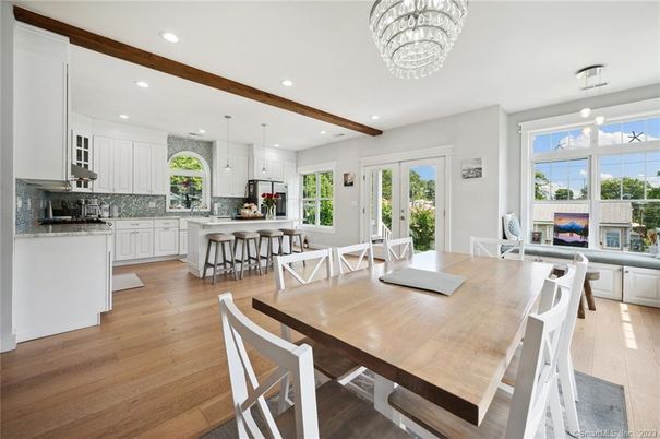 Chandelier, Dining room, Interior, Kitchen, Pendant Lights, Recessed Lighting, Stainless Steel Appliances, Wooden Beams, Wood Texture Flooring