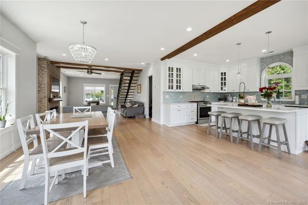 Chandelier, Dining room, Interior, Kitchen, Pendant Lights, Recessed Lighting, Stainless Steel Appliances, Wooden Beams, Wood Texture Flooring
