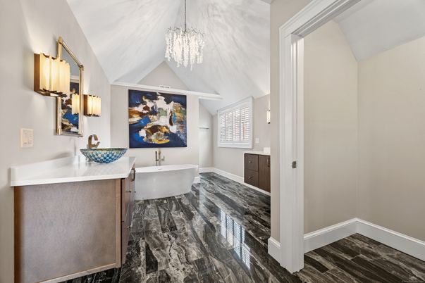 Bathroom, Chandelier, Dual Sink Vanities, Free Standing Baths, Interior, Marble, Pendant Lights, Wood Texture Flooring