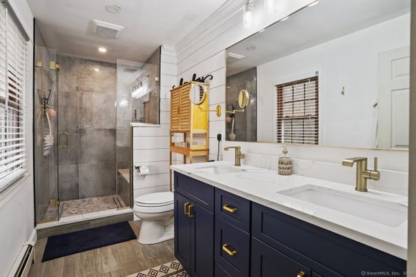 Bathroom, Dual Sink Vanities, Glass Shower, Interior, Recessed Lighting, Wood Texture Flooring