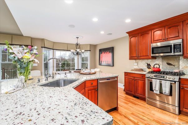Chandelier, Interior, Kitchen, Recessed Lighting, Stainless Steel Appliances, Wood Texture Flooring