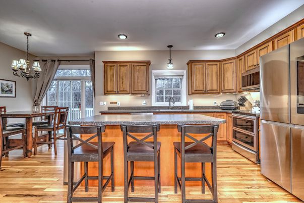 Chandelier, Dining room, Interior, Kitchen, Pendant Lights, Recessed Lighting, Stainless Steel Appliances, Wood Texture Flooring