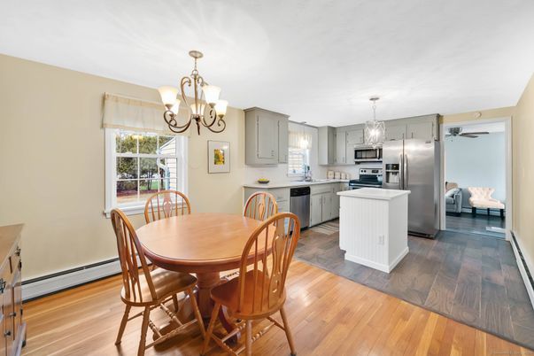 Chandelier, Dining room, Interior, Kitchen, Stainless Steel Appliances, Wood Texture Flooring