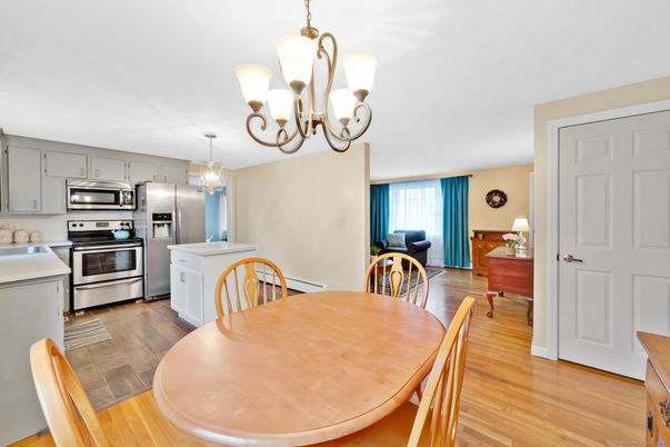 Chandelier, Dining room, Interior, Kitchen, Stainless Steel Appliances, Wood Texture Flooring