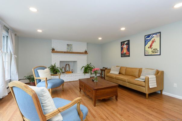 Fireplace, Interior, Living room, Recessed Lighting, Stone Walls, Wood Texture Flooring