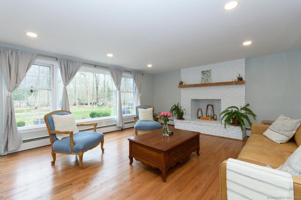 Fireplace, Interior, Living room, Recessed Lighting, Stone Walls, Wood Texture Flooring