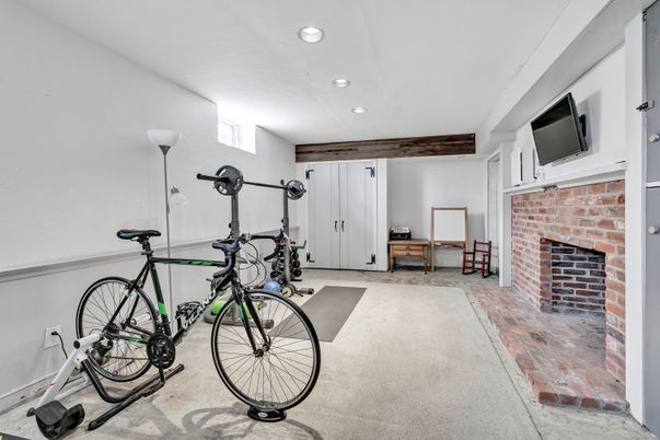 Fireplace, Fitness Equipment, Interior, Recessed Lighting, Stone Walls