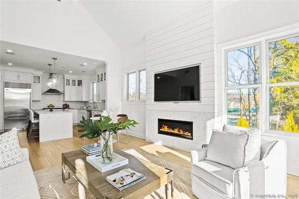 Fireplace, Interior, Kitchen, Living room, Pendant Lights, Recessed Lighting, Stainless Steel Appliances, Wood Texture Flooring