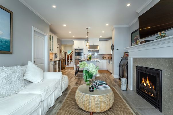 Fireplace, Interior, Kitchen, Living room, Pendant Lights, Recessed Lighting, Stainless Steel Appliances, Wood Texture Flooring