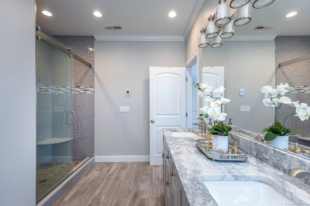 Bathroom, Dual Sink Vanities, Glass Shower, Interior, Recessed Lighting, Wood Texture Flooring