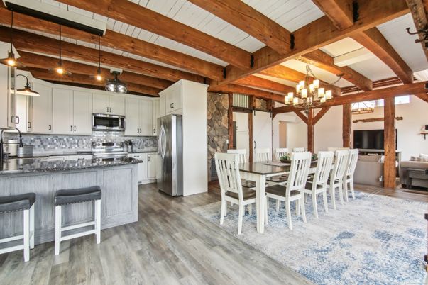 Chandelier, Dining room, Interior, Kitchen, Pendant Lights, Stainless Steel Appliances, Wooden Beams, Wood Texture Flooring