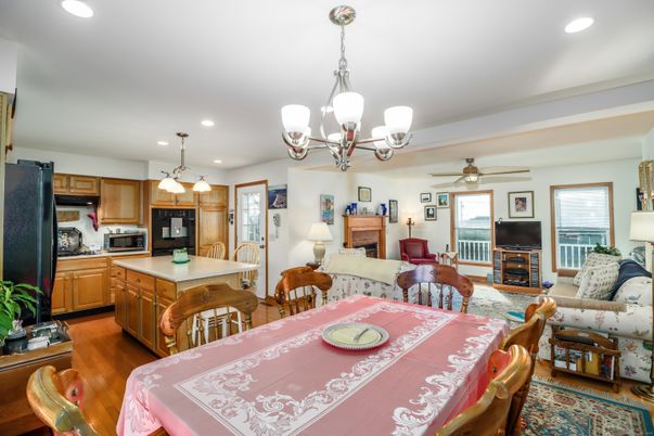 Chandelier, Dining room, Interior, Kitchen, Living room, Pendant Lights, Recessed Lighting, Stainless Steel Appliances, Wood Texture Flooring