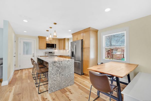 Dining room, Interior, Kitchen, Pendant Lights, Recessed Lighting, Stainless Steel Appliances, Wood Texture Flooring