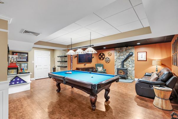 Billiard Table, Fireplace, Game Room, Interior, Pendant Lights, Recessed Lighting, Stone Walls, Wood Texture Flooring