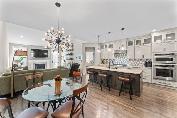 Dining room, Fireplace, Interior, Kitchen, Living room, Pendant Lights, Recessed Lighting, Stainless Steel Appliances, Wood Texture Flooring
