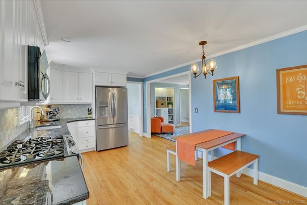 Chandelier, Dining room, Interior, Kitchen, Stainless Steel Appliances, Wood Texture Flooring