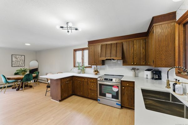 Dining room, Interior, Kitchen, Recessed Lighting, Stainless Steel Appliances, Wood Texture Flooring
