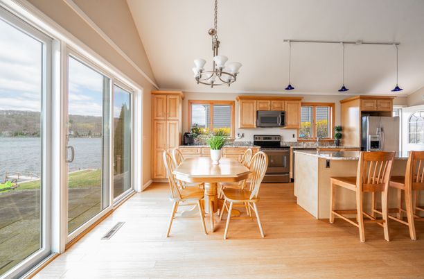 Chandelier, Dining room, Interior, Kitchen, Pendant Lights, Stainless Steel Appliances, Water, Wood Texture Flooring
