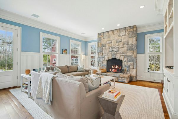 Fireplace, Interior, Living room, Recessed Lighting, Stone Walls, Wood Texture Flooring