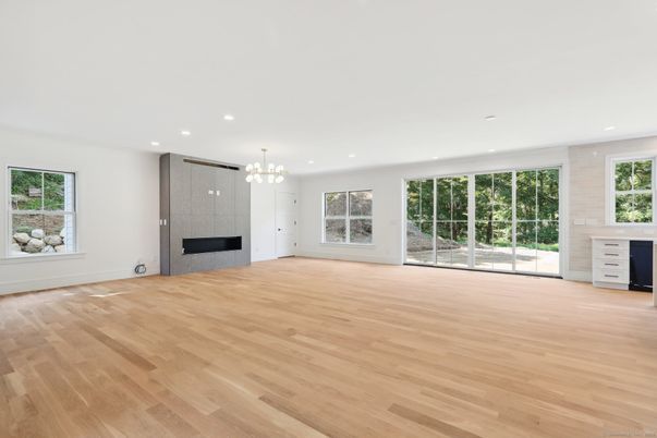 Chandelier, Empty room, Fireplace, Interior, Recessed Lighting, Wood Texture Flooring