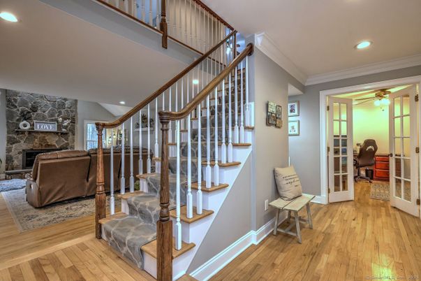 Fireplace, Interior, Living room, Recessed Lighting, Stone Walls, Wood Texture Flooring