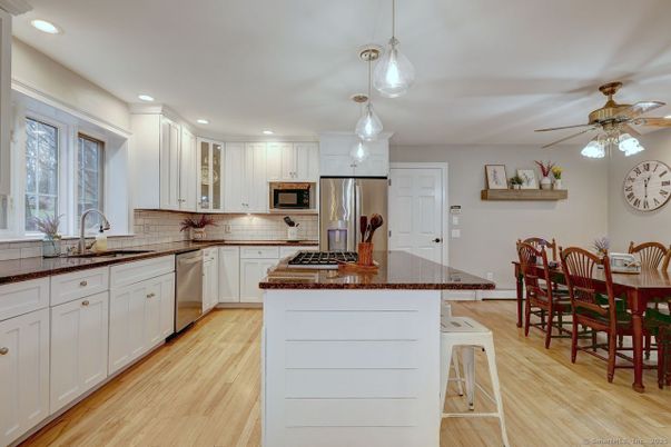 Dining room, Interior, Kitchen, Pendant Lights, Recessed Lighting, Stainless Steel Appliances, Wood Texture Flooring