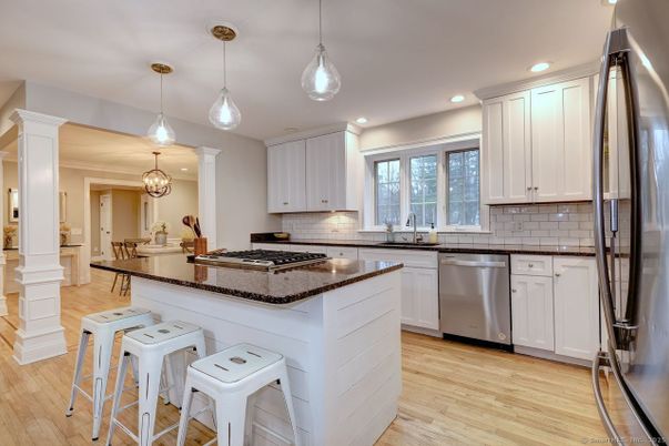 Chandelier, Dining room, Interior, Kitchen, Pendant Lights, Recessed Lighting, Stainless Steel Appliances, Wood Texture Flooring