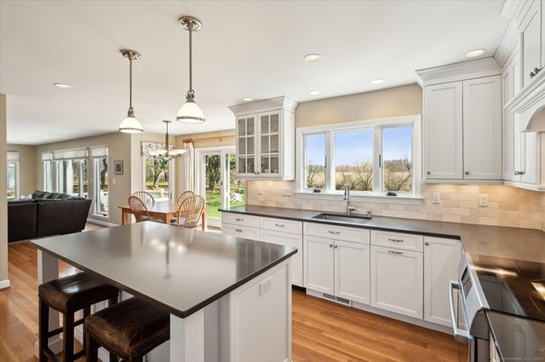 Dining room, Interior, Kitchen, Pendant Lights, Recessed Lighting, Stainless Steel Appliances, Wood Texture Flooring