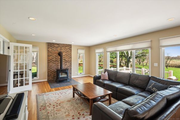 Fireplace, Interior, Living room, Recessed Lighting, Stone Walls, Wood Texture Flooring