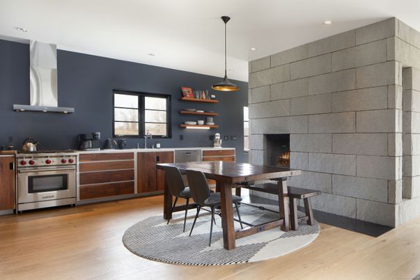 Dining room, Fireplace, Interior, Kitchen, Pendant Lights, Recessed Lighting, Stainless Steel Appliances, Stone Walls, Wood Texture Flooring