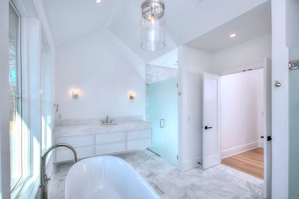 Bathroom, Dual Sink Vanities, Free Standing Baths, Interior, Marble, Recessed Lighting, Wood Texture Flooring