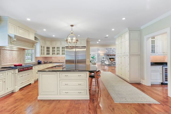 Chandelier, Fireplace, Interior, Kitchen, Pendant Lights, Recessed Lighting, Stainless Steel Appliances, Wood Texture Flooring