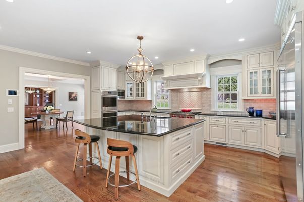 Chandelier, Dining room, Interior, Kitchen, Pendant Lights, Recessed Lighting, Stainless Steel Appliances, Wood Texture Flooring