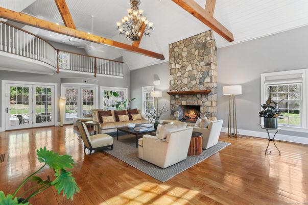 Chandelier, Fireplace, Interior, Living room, Stone Walls, Wooden Beams, Wood Texture Flooring