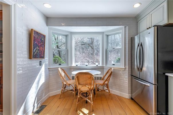 Dining room, Interior, Kitchen, Recessed Lighting, Stainless Steel Appliances, Stone Walls, Wood Texture Flooring