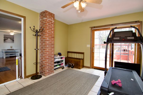Fitness Equipment, Game Room, Interior, Stone Walls, Wood Texture Flooring