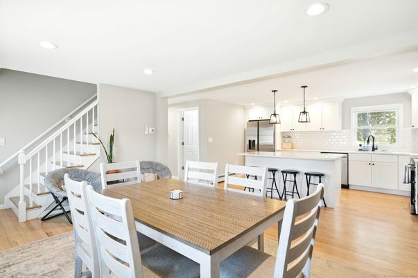 Dining room, Interior, Kitchen, Pendant Lights, Recessed Lighting, Stainless Steel Appliances, Wood Texture Flooring
