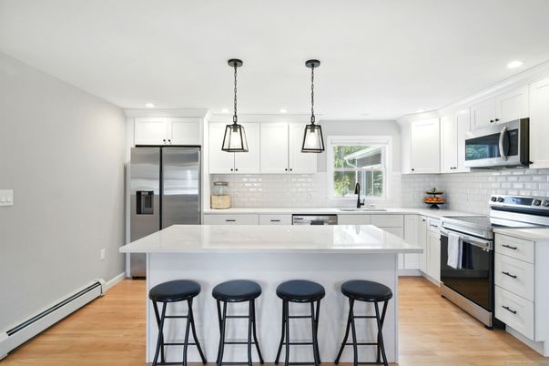 Interior, Kitchen, Pendant Lights, Recessed Lighting, Stainless Steel Appliances, Wood Texture Flooring