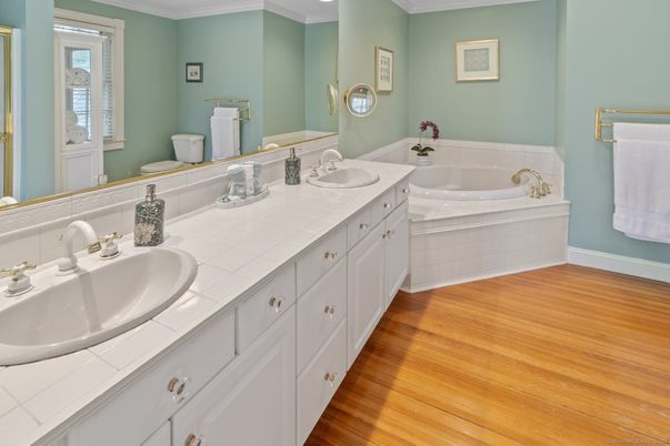 Bathroom, Dual Sink Vanities, Interior, Recessed Lighting, Tile Countertops, Wood Texture Flooring
