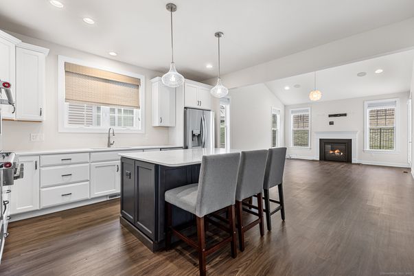 Fireplace, Interior, Kitchen, Pendant Lights, Recessed Lighting, Stainless Steel Appliances, Wood Texture Flooring