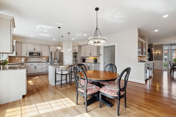 Dining room, Interior, Kitchen, Pendant Lights, Recessed Lighting, Stainless Steel Appliances, Wood Texture Flooring