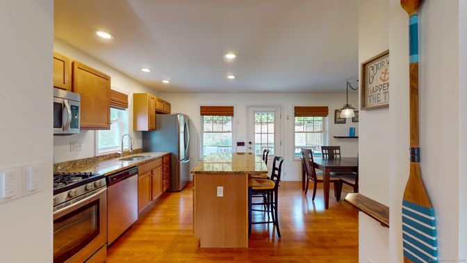 Dining room, Interior, Kitchen, Pendant Lights, Recessed Lighting, Stainless Steel Appliances, Wood Texture Flooring